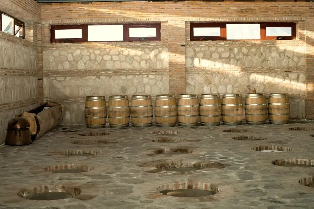 Barrels and qvevri openings in the marani
